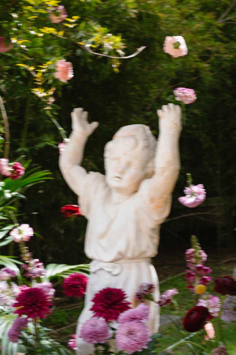 sculpture and flowers flying